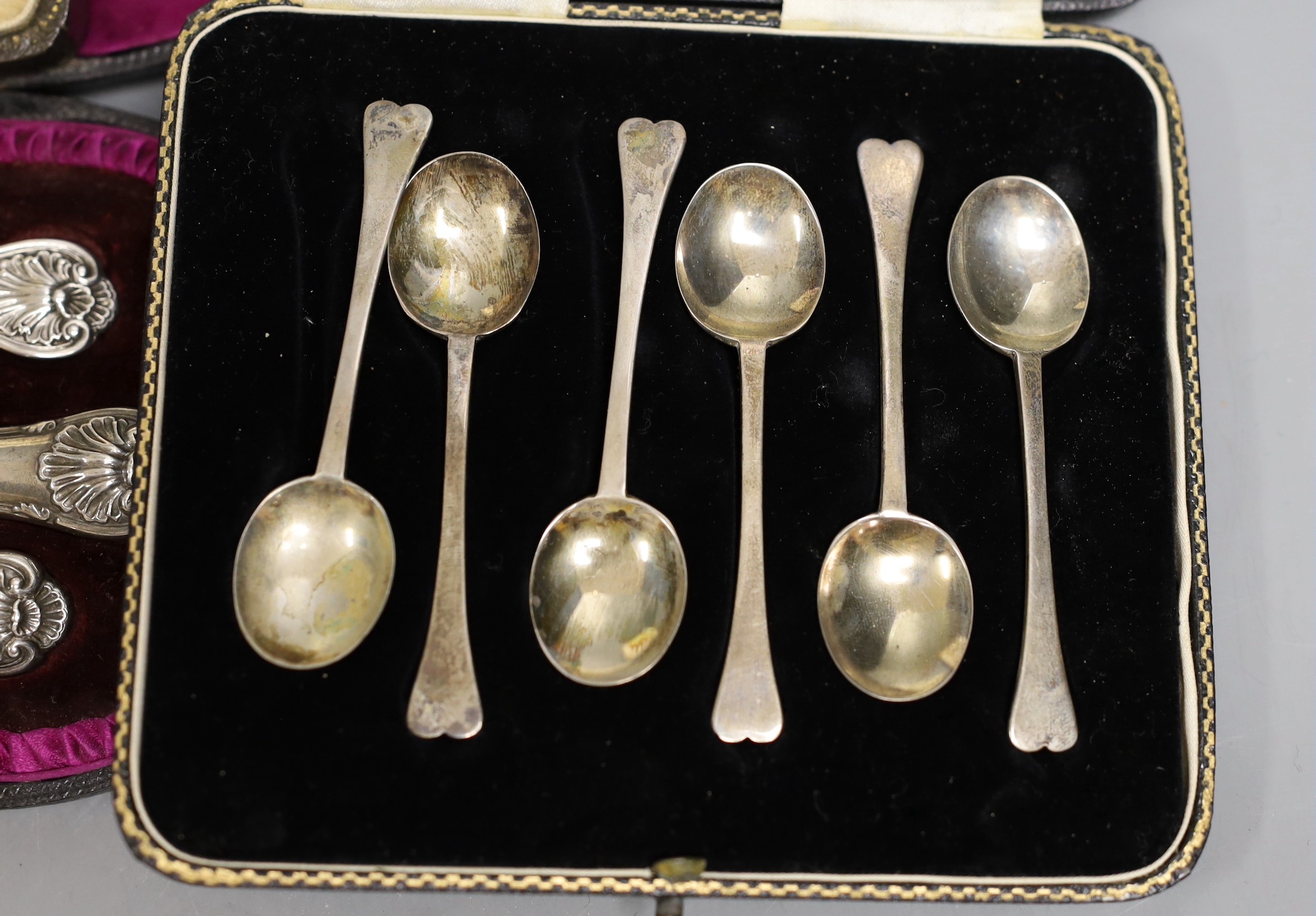 Four assorted cased sets of cutlery including a christening trio and a cased set of six silver and polychrome enamel, William Suckling Ltd. Birmingham, 1939.